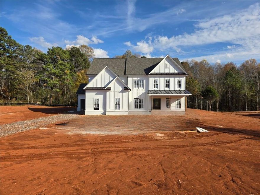 The Avondale Plan by Tipton Home Builders — This stunning open-concept Craftsman-style home offering 5 bedrooms, 4 bathrooms, with a 3-car garage, all situated on a spacious 1.70-acre lot with no HOA!!! From the welcoming covered front porch, step into an impressive two-story foyer that sets the tone for the elegant design throughout. The main level features soaring 10-foot ceilings (9’ on the upper level) and an ideal layout for both everyday living and entertaining. A private study sits opposite the formal dining room, which connects through a butler’s pantry to the gourmet chef’s kitchen. This kitchen is a showstopper, featuring a large eat-in island, ceiling-height cabinetry, quartz countertops, and stainless-steel appliances, including a double oven.
The kitchen opens to a bright breakfast area, a keeping room, and a family room featuring custom-built-ins and a designer fireplace. Step outside to the extended covered rear porch, complete with a brick fireplace — perfect for year-round entertaining, dining, and relaxation.
Additionally, the main level features a guest bedroom, a full bathroom, and a mudroom with built-in lockers, all conveniently located off the garage.
Upstairs, you’ll find an expansive primary suite with a spa-inspired bath, including a soaking tub, tiled glass shower, dual quartz vanities, and a large walk-in closet. Three additional bedrooms and two full bathrooms complete the upper level, along with a generous media room offering versatile space for a playroom, home theater, or gym. Ideally located with easy access to Hwy 400, shopping, dining, and entertainment, this home offers the perfect blend of luxury, comfort, and convenience. Home is under construction — please use caution when visiting.