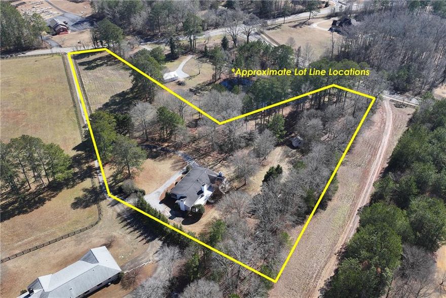 You have to see this one to believe it!!! This beautifully renovated ranch sits on nearly 6 serene acres, offering complete privacy and endless potential. Enjoy the expansive daylight basement, perfect for in-laws, college students, or just entertaining at the built in bar. Whether you enjoy gardening, envisioning a pool, or fishing in your pond, you have the freedom to create your dream without an HOA. Conveniently located just inside Cherokee County, you have access to great schools. Publix, dining, and various other entertainment, are just minutes away. Don't miss this rare opportunity 
Sellers never lived in the home. All info should be verified.