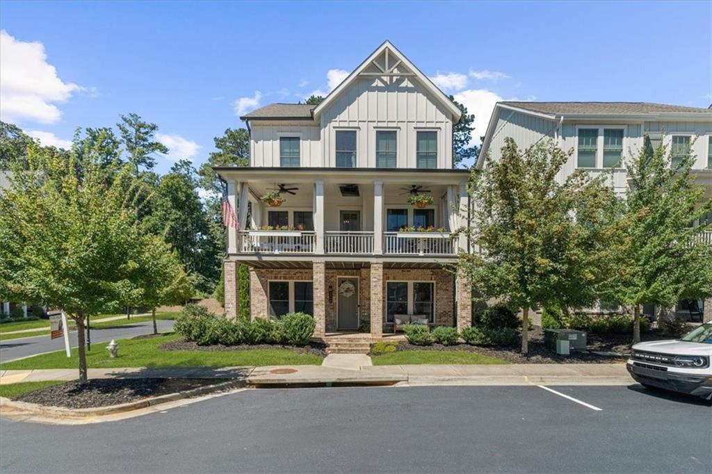 Originally the community model home, you will find upgrades throughout this EAST facing home. Elevator for easy access to all floors. 2 car garage has room for golf cart. You will love the proximity to schools, parks, and shopping (truly walkable!). Have a slow morning on the porch with your coffee or share a glass of wine on the back balcony or watch tv on the front balcony. The open concept living area is light-filled and perfect for entertaining or gathering with family. The spacious kitchen has upgraded Cafe appliances, large quartz island, double ovens, and pantry to please any cook. Upper floor has three ensuite bedrooms, so everyone has his or her privacy. A fourth ensuite bedroom is on the main level (currently serving as an office), and the fifth bedroom is on the ground floor with a separate bath detached. Designer touches throughout provide visual interest while maintaining serenity. Convenient yet private, bright and interesting, open for entertaining but with places to curl up and relax. Come see your next home! PROFESSIONAL PHOTOS COMING 8/26.