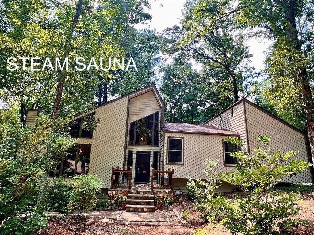 RELAX IN A WONDERFUL, SPACIOUS HOME IN A LOVELY AND PEACEFUL ESTABLISHED NEIGHBORHOOD.
Totally renovated, this spacious home is situated on a serene 3/4 Acre quiet wooded corner lot in a private Cul-De-Sac.
From a lovely front porch open door to a beautiful two-story foyer you'll walk into a spacious open great room with stone fireplace and vaulted cedar plank ceiling. Open plan dining room next to a large chef's kitchen with an island open to separate breakfast room, which opens to an oversized double deck patio.
Huge loft overlooking great room that can be used as additional bedroom or an office with an entertainment area, movie theater. Bedrooms feature walk-in closets, and 3 luxurious bathrooms, 2 large car garage.
Stunning full In-Law or guest suite with a kitchenette, separate bedroom with closets leading to a full bathroom with Steam Sauna.
A bonus room adds versatility and can be used as an office, exercise room or game room accessible to wet bar, full bathroom, Steam Sauna and laundry room.
Award-winning schools within a few blocks: Sope Creek Elementary, Dickerson Middle, Walton High.
Conveniently located near all Shopping, Restaurants, Movie theater and Gym.
Walking distance to Cobb County Sport Park offers Baseball fields, tennis courts, Soccer, and much more, minute to Chattahoochee River National Recreation.