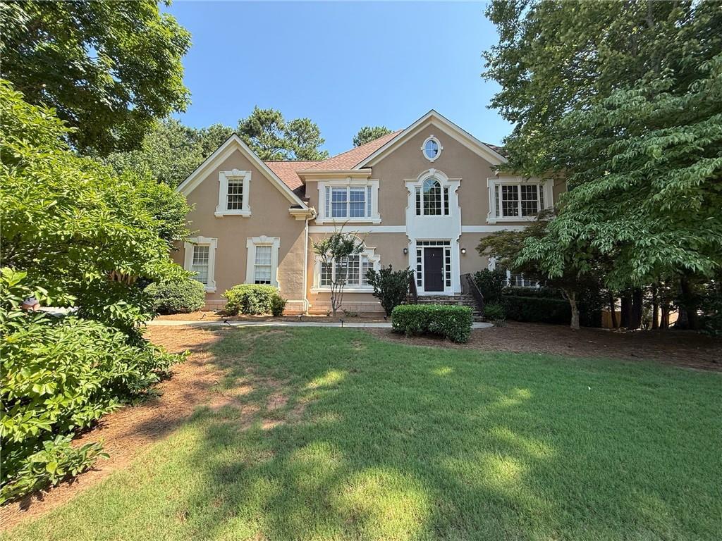 Fantastic home located in sought after Dunmoor subdivision. Dunmoor is a wonderful neighborhood with sidewalks throughout, a neighborhood pool, swim team, clubhouse, tennis courts and children's playground. The location of this wonderful house can't be beaten, the school bus stop is in front of this house! It has top-rated schools, minutes from Avalon and GA 400, and within walking distance to the Greenway. This home is on a level lot with a fenced and private backyard. Gourmet white kitchen includes granite countertops, SS appliances, tiled backsplash and is open to the family room and sunroom. The master suite is oversized with a sitting room, his/her walk-in closets, and a renovated bathroom with a frameless shower, travertine floor, double vanities. The daylight basement includes a full kitchen, full bathroom, 2 rec. rooms, and a bedroom. Freshly painted and new flooring in the basement. Landlords pay for lawn maintenance. Security deposit due 24 hours after binding lease. First and last months rent due 5 days prior to lease start date.
