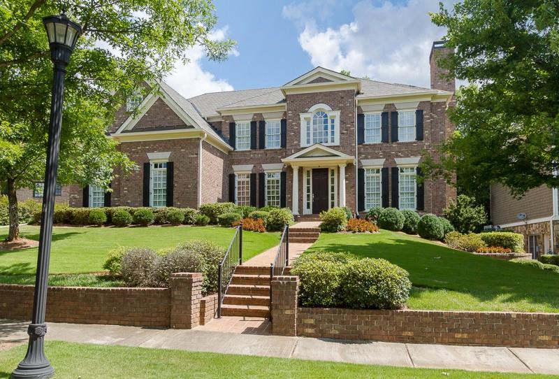The moment you enter this gated community the sense of home abounds, magnificent brick homes, surrounded by manicured lawns. Built by Providence builders this five bedroom and five and one half bath home is complete with an elevator, 10 foot ceilings, open floorplan, and paneled library. The grandeur extends to the foyer, living and dining rooms. A Master Bedroom suite includes a sitting room, spa bath and dual closets. Three en-suite bedrooms are on the second floor. The terrace level is complete with office, bedroom and bath. There is a three car side entry garage.
