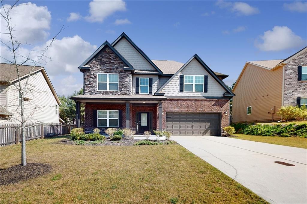 Welcome home to this stunning two-story residence that truly has it all! The kitchen is a chef’s dream, featuring granite countertops, stainless steel appliances, and a spacious island—perfect for meal prep and casual dining. Enjoy the elegance of a formal living and dining room, ideal for entertaining guests. Each bedroom offers the comfort of a walk-in closet, providing ample storage space. For added convenience, you'll find laundry on the main floor as well as an additional laundry room upstairs.