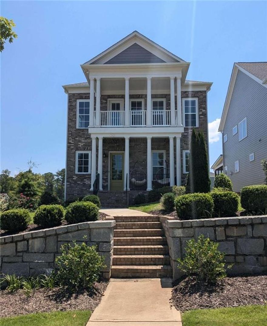 LESS THAN 1 MINUTE FROM AVALON! Welcome to 545 Hanlon Way, a charming 4-bedroom, 4-bathroom home in the heart of Alpharetta, offering an unparalleled lifestyle and prime location. This beautifully designed residence is minutes away from Avalon, with two spacious decks and a welcoming front porch, perfect for enjoying the stunning views of this vibrant area. Nestled on the most coveted lot in the community, this home offers breathtaking views of Avalon and easy access to all the amenities that make Alpharetta one of the most desirable places to live. Located just over a mile from "The Gathering," a highly anticipated $1 billion mixed-use project currently under construction, you'll be at the center of future shopping, dining, and entertainment venues. The convenience doesn't stop there-this home is also close to GA-400, Wills Park, Downtown Alpharetta, the Alpha Loop, and is situated in the highly sought-after Milton School District. Living here means you'll be at the heart of everything Alpharetta has to offer. As you step into the main level, you'll be greeted by a welcoming foyer area, leading to a guest bedroom and full bath-perfect for visitors or a home office. The terrace level offers versatile space that can be transformed into a media room, a fifth bedroom or in-law suite, and much more. The main floor features an open-concept design, seamlessly connecting the living room, kitchen, eat-in area, and dining room. Enjoy your morning coffee or evening cocktails on the back patio, which offers scenic views of Avalon and the community. Upstairs, you'll find a loft with amazing views toward Avalon, perfect for an office or playroom, along with the primary suite, which boasts a dreamy bathroom and two spacious closets. Two additional bedrooms, another full bathroom, and a convenient laundry room complete this level. With move-in ready conditions, 10-foot ceilings, and hardwood floors, this home is the perfect blend of modern luxury and convenience.