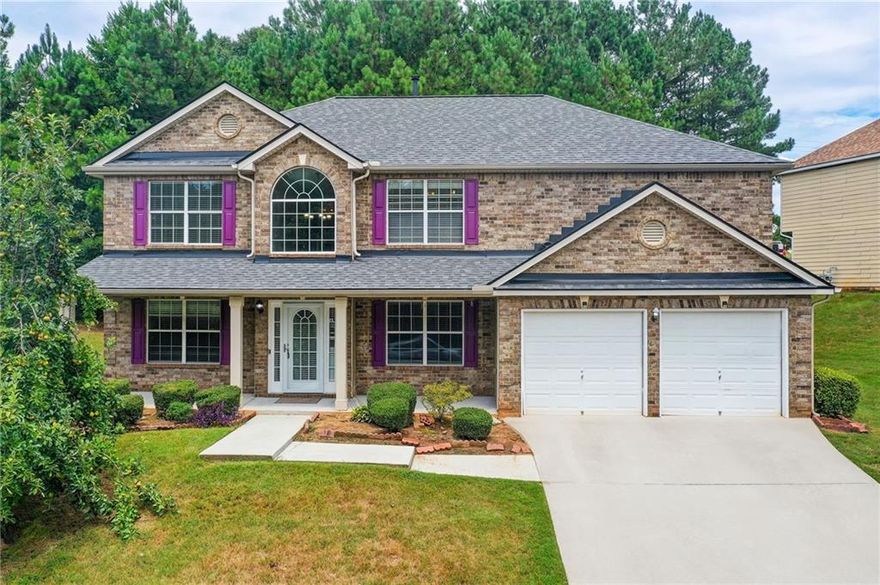Welcome to this beautiful move-in-ready home in the desirable Preserve at Travers Creek, a quiet HOA community in Conyers, Rockdale County. This spacious 4-bedroom, 3-bath home sits on a premium corner lot and features fresh paint, new carpet, a new roof, and modern light fixtures. Inside, enjoy hardwood floors in the living areas and plush carpet in the bedrooms. The main floor includes a formal living room, dining room, and open-concept kitchen and family room with a cozy fireplace, plus a guest bedroom and full bath. Upstairs, the large primary suite boasts a sitting area, walk-in closet, and an en-suite bathroom with dual vanities. Additional highlights include a freshly painted garage and exterior. This home offers comfort and style in a great location near schools, shopping, and dining. Don't miss this opportunity!