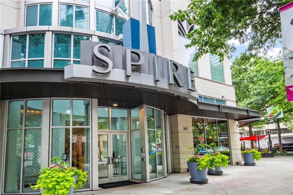 Exciting Updated Move In Condition with a Large 7th Floor Balcony - New Cosmetics, New HVAC, New Oven range, New Vent hood, and Polished Hardwood Type Floors, . . . Experience modern luxury on the 7th floor of the SPIRE Condominiums, FHA approved! Very exciting cosmetically updated 1-bedroom, 1-bath garden home. The balcony is freshly landscaped and spacious for large gatherings, entertaining, or just relaxing with a book. Enjoy abundant natural light in an open-concept layout that emphasizes convenience and efficiency with 10' ceilings throughout. An open gracious foyer kitchen area greets your guests. The open and tall main living room flows seamlessly from the modern kitchen to the open balcony with large planters. The spacious updated primary bedroom includes good closet space, while a spacious primary bathroom is equipped with a shower/tub and a large granite countertop vanity. A dedicated stack-able laundry area adds to the practicality of this garden style home. Ideal desk niche to organize and plan. Don't sweat it as shared, all new HVAC installed Too! Floor-to-ceiling windows offers generous daylight and the private balcony is the perfect spot to unwind while entertaining for hours. Residents enjoy premier amenities, including 24-hour concierge service, a gated entrance, rooftop pool, business center, key fob access, assigned covered parking, fitness center, game room, lounge area, dog park, and club room. Rental restrictions do apply, so please See HOA Management. Ideally located in Midtown with easy access to nearby downtown, restaurants, shopping, numerous services, education and I-75/I-85. Don't miss your chance to embrace modern luxury living in the heart of the city! A home that has it all, ideal for Fannie Mae Homepath Ready Buyer Program. See private remarks. Agents if Showing - Call the Concierge's Desk Before Going 404-961-7950 - Once on Site Go To Concierge's Desk When You Arrive to Receive Parking Pass To Park, Then Back to Concierge To Receive Access to Elevators and SUPRA Box. Very Exciting Home, Inspect, Compare and Price. Awaits Your Inspection! See Below To Show and How To Make an Offer.