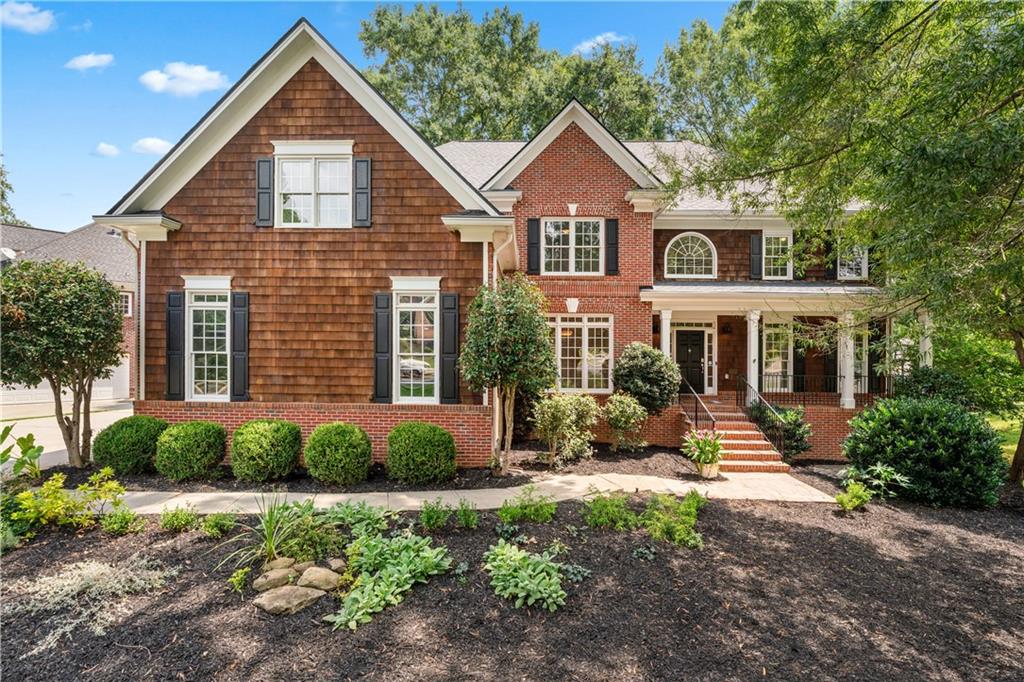Welcome to Kimball Farms — Where Lifestyle Meets Luxury in the Heart of Alpharetta! Ideally situated just minutes from GA 400, Avalon, and Downtown Alpharetta, this stunning brick home offers the perfect blend of elegance, functionality, and unbeatable convenience. Located in one of Alpharetta’s most desirable communities, you’ll enjoy top-rated schools and walkability to shopping, dining, and recreation.Step into a grand two-story foyer filled with natural light and hardwood floors throughout the main level. The open-concept layout includes a guest suite with a private bath, while the heart of the home—a beautifully updated kitchen—features navy cabinetry, quartzite countertops, stainless steel double ovens, a built-in microwave, and a spacious island perfect for meal prep and entertaining. A charming dining nook with picture windows and a sun-soaked flex room—ideal as a future butler’s pantry or coffee retreat—lead to a large deck, perfect for grilling and gatherings. This home offers a spacious main-level laundry room conveniently located off the kitchen, complete with a half bath, sink, and closet. With direct access from the garage, it offers excellent potential to double as a stylish and functional mudroom.The great room boasts soaring ceilings, oversized windows, and a cozy fireplace. Upstairs, you’ll find two bedrooms sharing a stylish Jack-and-Jill bathroom, a third en-suite bedroom, and a luxurious primary suite complete with a sitting area, vaulted ceilings, spa-like bathroom with jetted tub and a glass shower, and an expansive walk-in closet with attic storage.The finished terrace level offers incredible versatility imagine the possibilities a media area, billiards or game space, a private bedroom, full bath, and additional rooms ideal for a gym, studio, extra bedroom or home office—plus ample unfinished storage. NEWER ROOF, NEW PAINT, NEW DISHWASHER, NEW HVAC in Basement and NEW CARPET. Outside, enjoy a landscaped, level backyard with a serene wooded view. Additional highlights include a three-car garage with extra storage and access to resort-style amenities: Olympic-size pool, splash pool, tennis and pickleball courts, playground, clubhouse, and direct access to the Alpharetta Greenway and Alpha Loop. WALK or BIKE to the elementary school! Don’t miss your chance to call one of Alpharetta’s most vibrant and social communities home—Kimball Farms offers the lifestyle you’ve been looking for!