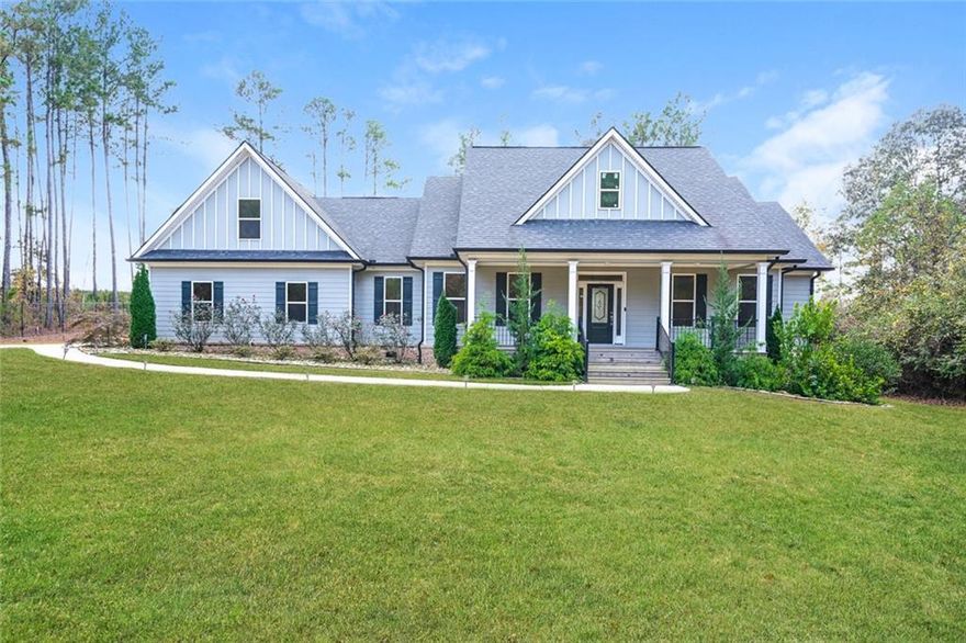 Located at 450 Kelleytown Road, McDonough, GA, this residential property in Henry County presents an attractive opportunity to own a home built in 2020 that is in great condition. The living room serves as a central gathering space, showcasing a fireplace that adds warmth and character, complemented by a beamed ceiling, coffered ceiling, and crown molding which elevate the architectural detail, while built-in shelves offer both functionality and a place to showcase treasured items. The kitchen is designed for both culinary exploration and social interaction, featuring a large kitchen island that provides ample workspace and a gathering point, a custom range hood that makes a statement, stone countertops that provide a durable and elegant surface, shaker cabinets that offer a timeless aesthetic, crown molding that adds a touch of sophistication, and a kitchen bar for casual dining or entertaining. The bathroom provides a spa-like experience with its double vanity that offers convenience and space, a tiled walk-in shower that exudes luxury, and a soaking tub that invites relaxation and rejuvenation. The bedroom provides a comfortable retreat, enhanced by crown molding that adds a touch of elegance. Additional features include a porch where you can relax and enjoy the outdoors. This 2830 square foot property offers a blend of modern living and timeless design.