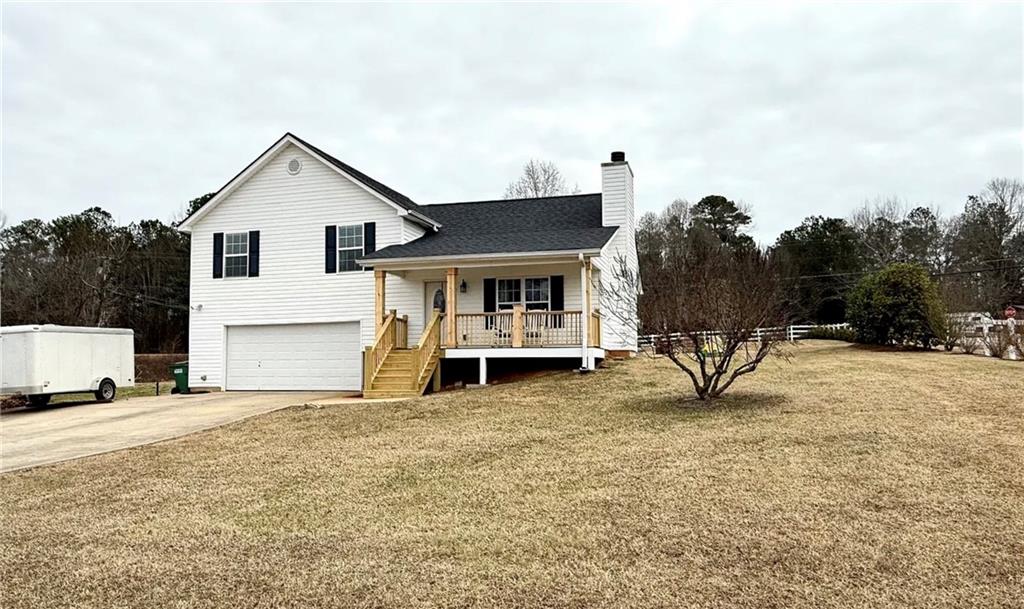 This fantastic 1.5-acre lot offers plenty of usable land and is the perfect setting for a family home. The well-maintained 3-bedroom, 2-bathroom house features beautiful tile bathrooms, a cozy living room with a fireplace, and an oversized master suite complete with a master en suite, standalone shower, and soaking tub. The 2-car garage provides great storage space, and the laundry area is conveniently located in the mudroom. Outside, the expansive lot gives ample room for children and pets to play, with additional features like a fire pit and an outbuilding. Best of all, there's no HOA! Great location...easy access to Highway 365 for those that commute. Close to Clarkesville and Cornelia.