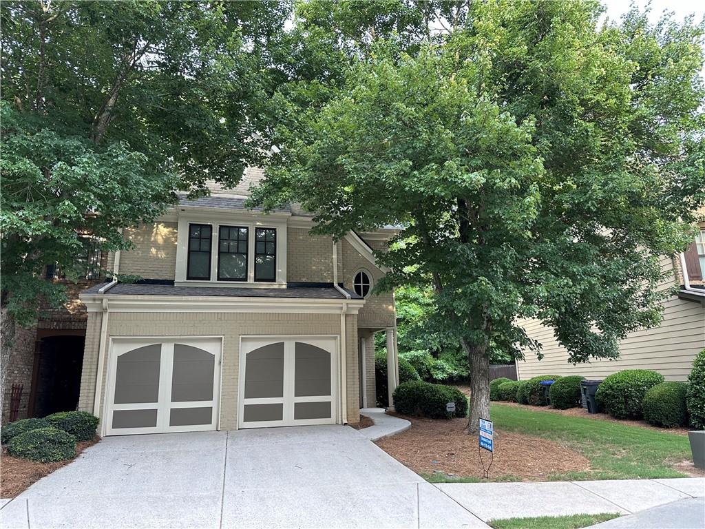 Spacious end unit with upgrades including granite counter tops, tiled back splash, large cabinets, and breakfast bar. Open floor plan, hardwood floors, double foyer, half bath on the main. Quiet relaxing backyard with patio. Active swim and tennis community with clubhouse, playground. Minutes to Hwy 400, shopping, food in close proximity including Avalon and Halcyon. Large master with vaulted ceiling, fan, double vanities, separate shower, garden tub. Two large bedrooms, full bath. Laundry room with washer and dryer. 2 car garage. Trash, yard work, and the neighborhood amenities are included in the rent.