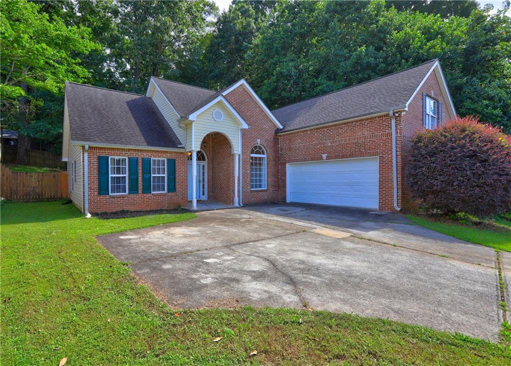 Welcome home! This 4-bedroom, 2-bathroom ranch-style residence offers spaciousness, functionality, and a flexible layout. Step inside to a bright living area with high ceilings, a cozy fireplace, and direct access to an enclosed patio overlooking the fenced backyard-perfect for relaxing or entertaining. The eat-in kitchen overlooks the living rooms, while a formal dining area adjacent to the kitchen provides additional seating. The desirable split-bedroom floor plan ensures privacy for the primary suite, featuring a walk-in closet, soaking tub, separate shower, and double vanity. Three additional bedrooms and a second full bathroom are located on the opposite side-ideal for guest rooms, a home office, or flex space. Additional highlights include a 2-car garage, a laundry room, and abundant natural light throughout. Conveniently located just minutes from I-75, only 16 miles to the Domestic Terminal and 11 miles to the International Terminal, 27 miles from Buckhead North, and just 11 miles from Bridges at Jodeco - your go-to destination for Costco, Sprouts, Chick-fil-A, and more! Proof of 1 year rental history required, no evictions or unpaid rent, favorable credit history. Square Footage per public record is 1,938