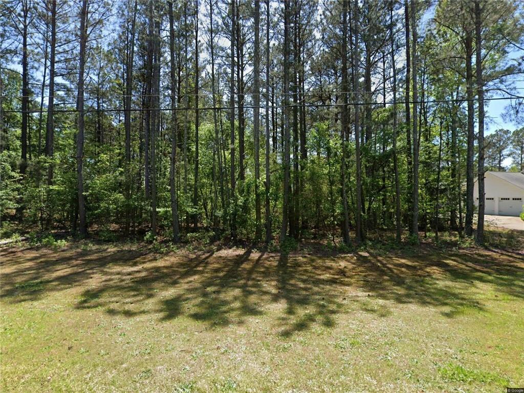 Build your dream home on this serene 0.53-acre lot within the prestigious St. Andrews Country Club Estates in Winston, GA. Nestled in Douglas County, this tranquil parcel offers both seclusion and convenience, with public utilities already available to help streamline your construction process.
Situated on a spacious, level lot with mature trees and residential charm, this property provides flexibility for custom design choices—whether envisioning a cozy family home or an elegant estate complete with outdoor living spaces. Its substantial size gives you the freedom to lay out your perfect layout while maintaining privacy from neighboring homes.
This lot represents a rare opportunity in a well-established community. Don’t miss your chance to secure one of the few remaining build-ready sites in this sought-after locale.