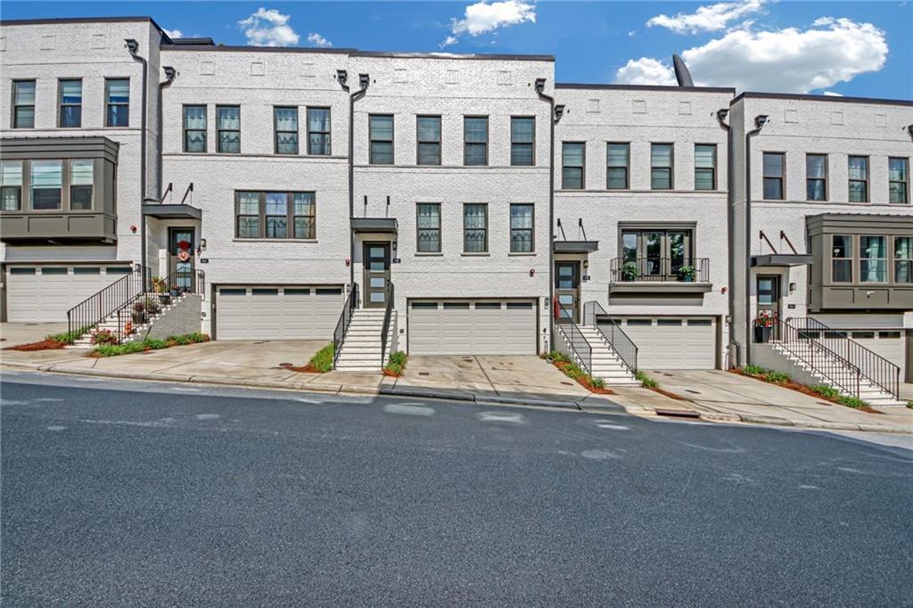 THE BEST OF THE BEST.... This four level elegantly appointed townhome with the finest finishes including surround sound. Main level with gourmet kitchen, oversized island and stainless steel appliances. Large living area plus breakfast area or home office plus powder room. Owner's primary suite features two walk-in closets and luxurious bath. Two additional well appointed bedrooms and full bath. The private rooftop is unmatched with skyline views of City of Atlanta and Buckhead with additional bath is ideal for home office. The lower level features a media room with full bath that may be used as a 4th bedroom.