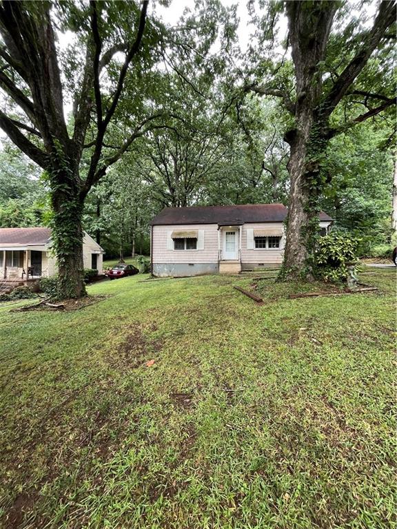 Charming East Lake Opportunity - Investor Special! 2 bedroom, 1 bathroom home located in the heart of East Lake, just minutes from the prestigious East Lake Golf Course. This property is a prime opportunity for investors or builders-perfect for a full renovation or a tear-down and rebuild project on a leveled 0.300-acre lot. Sold As-Is. Cash or hard money offers preferred. Don't miss your chance to invest in one of Atlanta's most desirable and rapidly growing neighborhoods. Bring all reasonable offers!