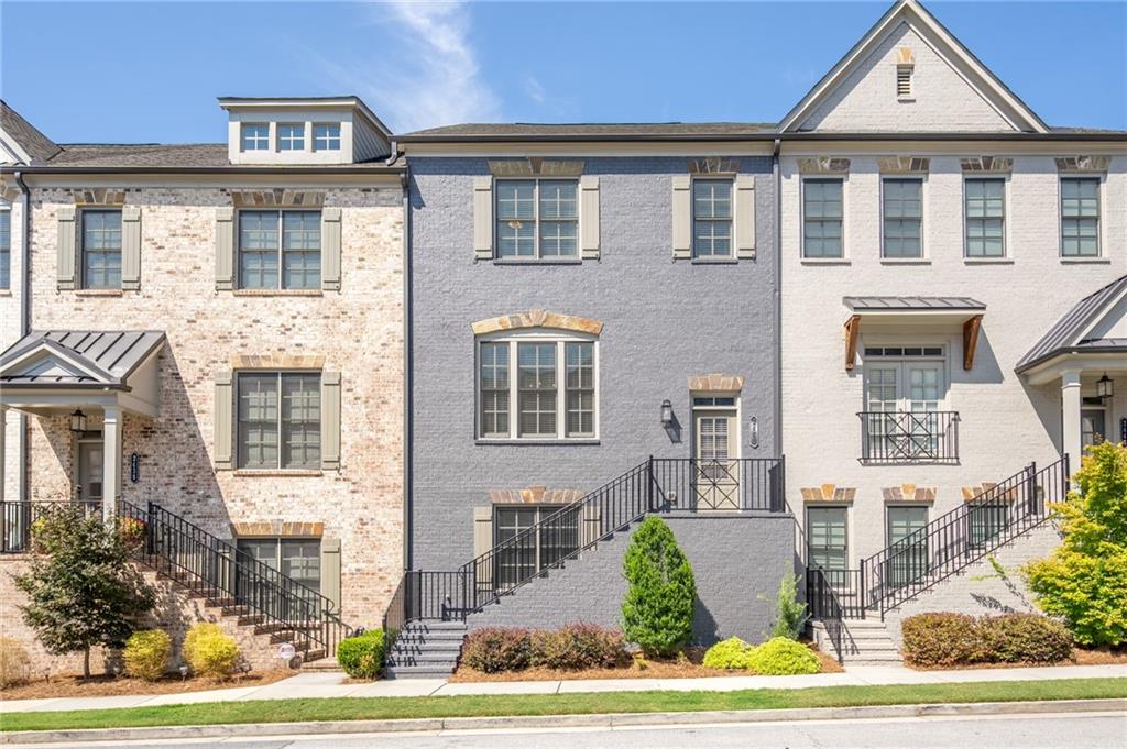 Welcome home to this sophisticated and spacious 2019 executive-style townhouse located in "Skyland Brookhaven". Each room of this beautifully designed townhouse is graciously sized to accommodate a carefree and comfortable lifestyle without feeling "cramped"…so prevalent in many of today's townhouse communities. High ceilings; rich crown moldings; hardwood floors; extra wide hallways; and a cozy, family room with fireplace (flanked by custom built-in bookcases and cabinetry) are just a few of the features that make this home stand out from the competition. With an open floor plan, designer colors and finishes, and over 2,850 square feet of living space, this home checks all the boxes...grand cook's kitchen with spacious center island, over-sized family room, and sumptuous owner's retreat. The four bedrooms and three and a half baths, offer ample room for family, friends, working from home, or choose a flex space perfect for a media/game room. Two-car garage, private outdoor deck, and a full array of amenities (community pool, clubhouse and workout facility) with playground and dog park just steps away (at Skyland Park) provide you with every excuse to stay home and enjoy the lifestyle of this beautiful development. Known for it's sense of community, highly sought-after schools, and special activities/events, the heart of Brookhaven...including Brookhaven Village Place...is SO close with its own mix of shops, restaurants, and a week-end farmer's market. This “fee-simple” townhouse in a community with reasonable monthly fees and an attentive HOA, is a lovely place and the perfect spot to call home. Best of all…you’ll be SO close to many of Atlanta's best-known landmarks and destinations...Emory, CDC, Children's Healthcare of Atlanta, Midtown, Buckhead and so much more…. Please see our lovely photos and schedule a showing before it's reserved.