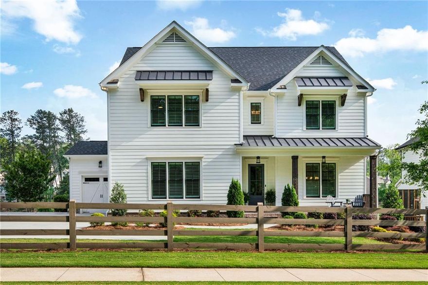 Welcome to the home that has it all luxury, location, and lifestyle. Nestled in the highly sought-after Ellis community, just minutes west of the vibrant Marietta Square and located within the desirable West Cobb school district, this 5-bedroom, 4-bathroom stunner is where refined design meets everyday ease. Built in 2020 by the esteemed Waterford Homes, this property is a modern masterpiece with timeless appeal. Step inside to find gleaming hardwood floors, plantation shutters, and designer finishes throughout. The open concept main living area is light-filled and inviting, anchored by a bright, airy living room that offers serene views of the picturesque community pond. A formal dining room sets the stage for elegant entertaining, while the oversized quartz island and chef-inspired kitchen deliver everyday function with elevated style. Need a flexible layout? The main-level bedroom with adjoining full bath is the perfect guest suite or office escape. Upstairs, the spacious primary suite is your private sanctuary complete with a soaking tub, oversized mosaic-tiled shower, dual marble vanities, and a dream walk-in closet with custom built-ins for your inner fashion lover. Two additional bedrooms share a stylish Jack and Jill bathroom, while a fourth upstairs bedroom enjoys privacy and access to another full bath. Step outside to enjoy double decks with tranquil pond views ideal for morning coffee, evening wine, or just soaking in the peaceful surroundings. The full daylight basement is ready for your personal touch, while the 3-car garage (including a boat door!) and irrigation system check every practical box. Ellis offers an unmatched lifestyle with amenities including a clubhouse, resort-style pool, tennis courts, pickleball courts, and scenic nature trails. Whether you’re casting a line in the pond or hosting on the back deck, this home invites you to live, relax, and thrive.