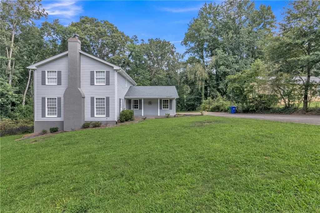 Beautifully remodeled 4-bed, 2.5-bath home in sought-after Southland! The expanded kitchen features a large island, breakfast bar, and updated lighting, flowing seamlessly into the spacious living area and a beautiful covered deck, ideal for entertaining or enjoying morning coffee or tea while deer occasionally visit the private backyard. Upstairs offers a generous primary suite with radiant heated floors and three additional bedrooms. The full daylight basement provides space to grow, plus a workshop and extra storage. With a 2-car side-entry garage, modern updates, and peaceful surroundings, this home is move-in ready all on a half acre lot with no HOA.