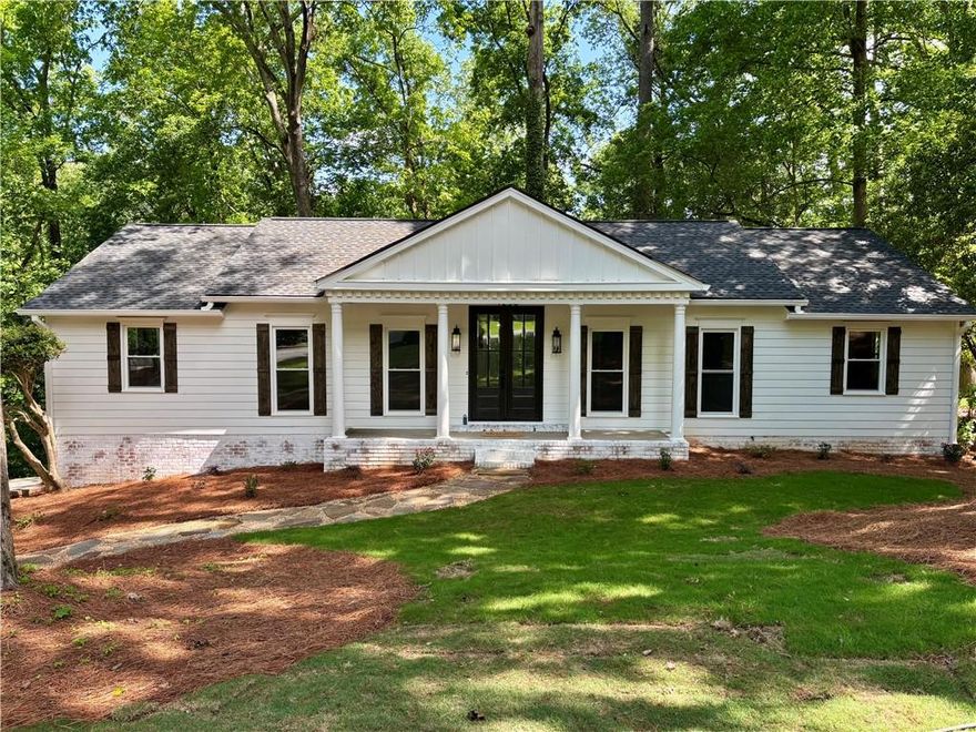 Stunning Renovated Ranch in Sunderland neighborhood on a spacious cul-de-sac lot with many updates and modernizations such as new plumbing, electrical, new HVAC, and water heater. The homes exterior features new roof/gutters, windows, paint, exterior doors and garage doors. The cozy kitchen has custom cabinets, quartz countertops, a marble backsplash and walk-in pantry. Brand new KitchenAid stainless steel appliances and modern touches like a pot filler. Gorgeous hardwood floors throughout the main level. The main and lower level fireplace features new glass doors and wood beam mantels. The separate dining room includes a modern light fixture and classic chair rail, while the formal living area offers incredible versatility – perfect as an office or playroom. The primary bedroom featuring two custom-shelved closets that provide ample storage. A fully finished basement which has been waterproofed, offering additional living space with two extra bedrooms, a full bathroom, spacious great room with fireplace that opens to a covered patio and large laundry room with sink and additional storage.

The backyard backs up to Marist School property with a large deck, features a creek that ensures privacy and an opportunity to make it a private oasis. Located with easy access to 285 and 400, this home is conveniently situated near Dunwoody, Brookhaven and Buckhead. Close to top schools including St. Pius X, Marist, and Chamblee Charter as well as 3 major hospitals including CHOA.

Sold AS IS, this unique renovated home represents an extraordinary opportunity for those seeking a move-in ready property with countless upgrades and a prime location.