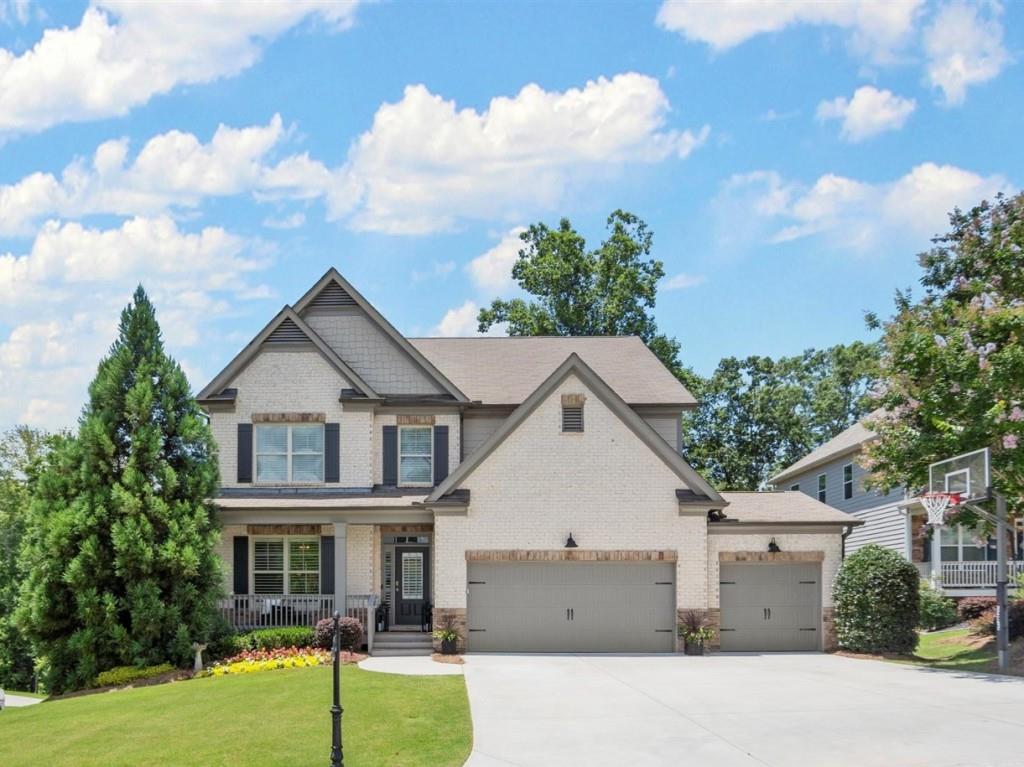 Prime Location, Stunning 5 bed 4 bath east facing home located in the highly sought after Carruth Lake Estates Subdivision in North Forsyth. Former model home is an entertainers dream and has so much to offer! Enter the foyer through the front door and you will have an amazing view into the open floor plan and dining area. Kitchen is a chefs delight and includes a large island, white shaker cabinets, butler's pantry, double oven, gas cooktop, under cabinet lighting, granite counters, subway tile backsplash, and huge walk-in pantry. Living room is a great size with a stack stone fireplace. Full Bed and Bath on the main level is great for guests or an office. Upstairs you have 3 additional bedrooms including the Primary suite and loft area for additional entertaining. Primary suite is oversized and features a sitting room creating a beautiful ambiance. Primary bath has a soaking tub, separate shower with his and her sinks. The Backyard is a nature lovers paradise! This is a large, fenced in lot with 2 side gates and double rear access gate, added living area with a screened in porch and uncovered deck for enjoying the outdoors. Finished basement complete with custom features included bedroom, full bath, gym, large family/gaming room and walkout access to basement level driveway. 3 car garage and level driveway with inground basketball goal. Yard has matured landscaping and irrigation. Many upgrades throughout! Neighborhood is conveniently located to 400, shopping, schools, Lake Lanier and so much more! HOA amenities offer 2 pools, 2 playgrounds, walking trails, fishing lake, clubhouse, firepit, pickleball, tennis, basketball and so much more!