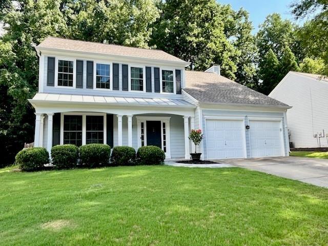In the sought after Cambridge HS district, this family friendly 4 bed, 2.5 bath is walking distance to Cogburn Road Park and Hopewell MS. Low HOA with swim/tennis. Walking distance to multiple restaurants. This home has a newer roof, dual zone HVAC, water heater, and updated kitchen and bathrooms. Durable new LVP flooring throughout, great for kids and pets! New carpet on stairs. The private, fenced-in backyard includes a spa and has plenty of space for a playset. Inside, you'll find a light-filled open kitchen and living area, a dining room with seating for 10+, an adjoining den /office, and a welcoming foyer space with two closets and half bath. Upstairs features a spacious primary suite with high ceilings and ensuite bath, his/hers walk-in closets, plus three additional bedrooms, a full bath and laundry. This home has been extremely well maintained, is updated, and truly move-in ready!