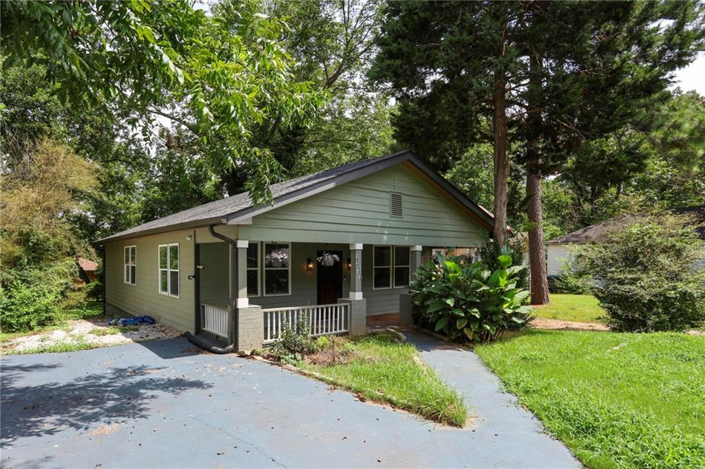 Welcome to this perfectly positioned property in the vibrant heart of East Point! This bright and spacious 3BR/2BA home boasts beautiful hardwood floors throughout, a modern kitchen with stainless steel appliances, and plenty of natural light. Enjoy mornings on the charming front porch and host unforgettable gatherings in the large, private backyard - perfect for entertaining!