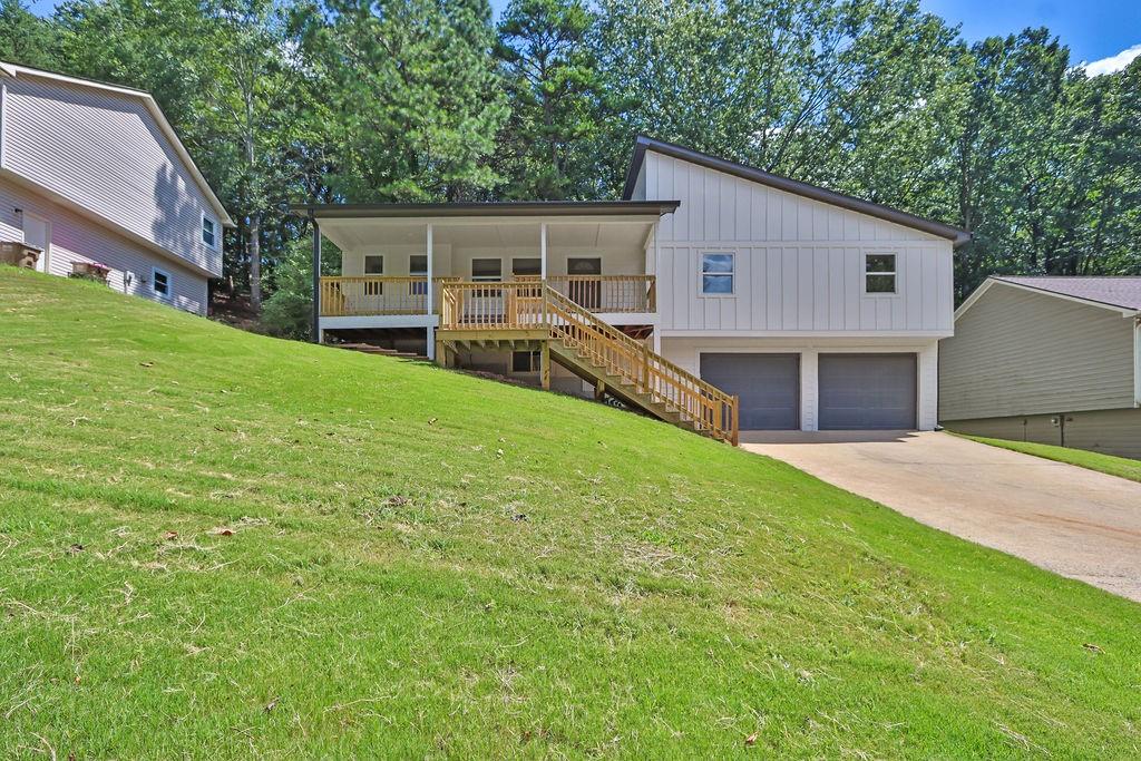 Welcome to your dream house- Completely remodeled from top to bottom, inside and out. This home has been transformed with premium upgrades and luxury finishes, making it better than new but without the new construction price tag. This home has an unbeatable value, high-end quality, and thoughtful design. Your search ends here! BRAND NEW Siding, Roof- offering not only a fresh, modern look but also long-lasting durability for years to come and peace of mind. Out back, you will find a HUGE deck that's perfect for outdoor entertaining, weekend BBQ, or simply relaxing under the stars. Inside, fresh paint throughout the home, the open concept layout flows effortlessly from room to room. The kitchen has been completely re-imagined with all-new cabinets, gorgeous quartz. All new flooring throughout the home. Modern lighting fixtures. Completely remodeled bathrooms! In 2024, HVAC and water heaters were replaced, and all windows are less than 2 years old. New garage doors. Even the landscaping has been refreshed to perfection. Every inch has been carefully curated with today's buyer in mind. This property delivers! It's not just a house, it's a place to create memories. Don't miss this opportunity!