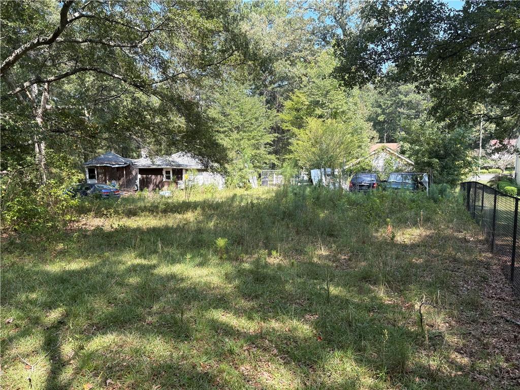 Rare opportunity in the City of South Fulton! This double lot is positioned directly behind the newly built College Heights community and comes with public utilities already in place. A demolition permit has been applied for to remove the existing fire-damaged structure, opening the door for a fresh start. With the potential to subdivide and build two new homes, this property offers excellent upside for builders, investors, or anyone looking to create value in a growing area.