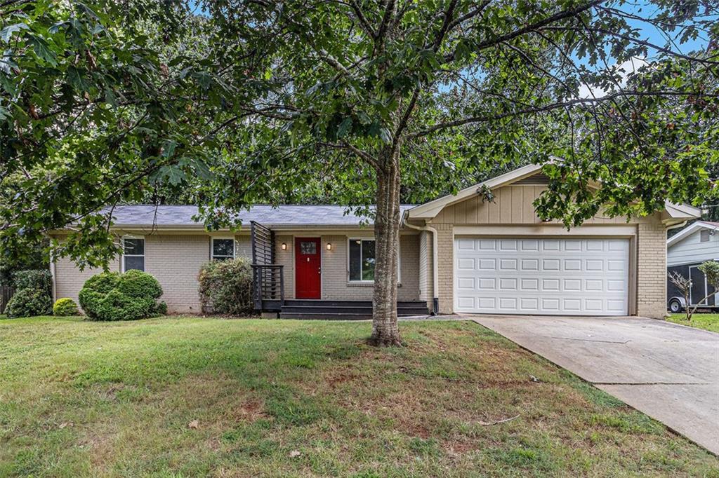 Ranch-style home featuring a 3/2 layout, a two-car garage, and plenty of backyard space perfect for outdoor living. The property includes a spacious back deck ideal for entertaining or relaxing. Functional single-level design makes for comfortable everyday living. Move-in ready with great potential for both homeowners and investors.