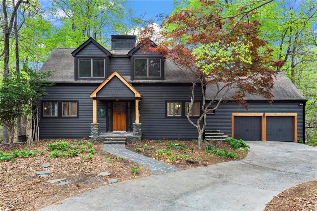 Tucked away on a peaceful, one-acre wooded lot with no HOA, this exceptional 5-bedroom, 3.5-bath home offers the perfect harmony of privacy and modern comfort, complete with a fully finished basement.
Step inside to an airy, open-concept floor plan bathed in natural light from floor-to-ceiling windows. A stylish half bath adds convenience, while the spacious family room is anchored by beamed ceilings and a striking brick fireplace, creating a warm, inviting atmosphere.
The gourmet kitchen is a true showstopper designed for both everyday living and effortless entertaining. It boasts granite countertops, stainless steel appliances, abundant cabinetry, a wet bar/produce prep area, and an under-counter microwave. A generous breakfast bar connects seamlessly to the open main living space, complemented by a light-filled dining room and cozy breakfast nook.
Retreat to the oversized primary suite, where a tray ceiling, fireplace, and large windows create a serene sanctuary. This suite features a private laundry closet, a fully built-out walk-in closet, and a spa-inspired ensuite bath complete with heated tile floors, dual marble vanities, custom cabinetry, a freestanding soaking tub beneath a stained glass window, and a glass-enclosed tile shower.
Upstairs, two spacious secondary bedrooms share a beautifully appointed full bath, offering comfort and flexibility for family or guests.
The fully finished terrace level feels like its own retreat, showcasing a floor-to-ceiling brick fireplace, custom built-ins, and brand-new LVP flooring. Perfect for game nights or cozy evenings in, this level also features a bar area, additional bedrooms, a full bath, and a full-size laundry room ideal for hosting guests or creating a multi-generational living space.
Outdoor living is just as impressive, with multiple gathering areas including a main-level deck with built-in gas line, a screened porch, a terrace-level deck, and a serene water feature for the ultimate in relaxation.
This home is a rare find: offering timeless charm, luxurious upgrades, and unmatched tranquility, all within easy reach of city amenities. Don’t miss your chance to make it yours!