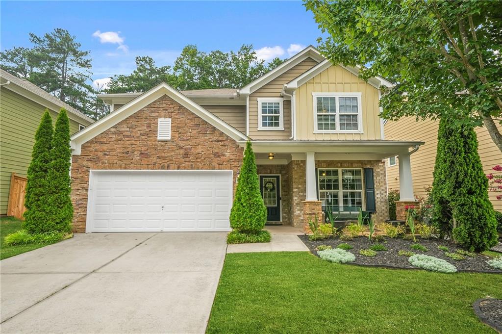 Welcome Home to Harmony on the Lakes! This stunning 2 story traditional 5 bedroom, 4 bath home offers space, charm, and thoughtful design in one of the most sought-after neighborhoods around. A large, rocking chair front porch sets the tone—welcoming you in with Southern hospitality and timeless curb appeal. Step into a spacious entrance foyer that flows seamlessly into an open-concept layout, perfect for today’s lifestyle. The chef’s kitchen is a true showstopper, featuring stained cabinetry, a generous walk-in pantry, and both a breakfast bar and sunlit eat-in area overlooking the great room. A butler’s pantry makes enjoying family dinners or entertaining in the large dining room a effortless. Gather around the stacked stone fireplace and enjoy effortless connection whether you're hosting or relaxing. Guests or in-laws will love the main-level bedroom and stepless tiled full bath. The main level is completed with a smart home management zone includes a hall tree with bench and built-in storage to keep life organized. Upstairs, a flexible secondary living area offers the ideal space for a playroom, gaming nook, or homeschool station. The oversized owner’s suite is a true retreat, complete with a tray ceiling, cozy sitting area, and spa-like bath featuring dual vanities, a soaking tub, a separate tiled shower with built-in bench, and spacious his-and-hers walk-in closets. Three additional upper-level bedrooms offer generous layouts and walk-in closets—two share a beth with a double vanity, while the third enjoys the privacy of its own en suite. Enjoy morning coffee or evening wine under the covered patio, with views of the flat, private backyard—ready for a playset, garden, or firepit. This home checks every box for space, flow, and comfort—all in the heart of a vibrant community with resort-style amenities, top-rated schools, and easy access to everything you need. Concession provided for interior paint & carpet. Schedule your showing today—this one won’t last long!