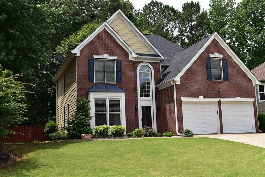Wonderful home in popular Towne Lake community. NEW PHOTOS COMING SOON. Final touches being done for this move in ready home with fresh paint (updated photos coming - ignore these paint colors) newer carpet on main, hardwood floors upstairs. All new stainless appliances in the kitchen plus granite counters, breakfast area with view to family room and wonderful sunroom. Private wooded fenced backyard. Large master and three additional bedrooms up with two full baths. Great amenities, walk to pool, nearby shopping, restaurants, schools and golf. Credit and background checks required. Income should be 3 times the monthly rent. Owner prefers a credit score of 620+.