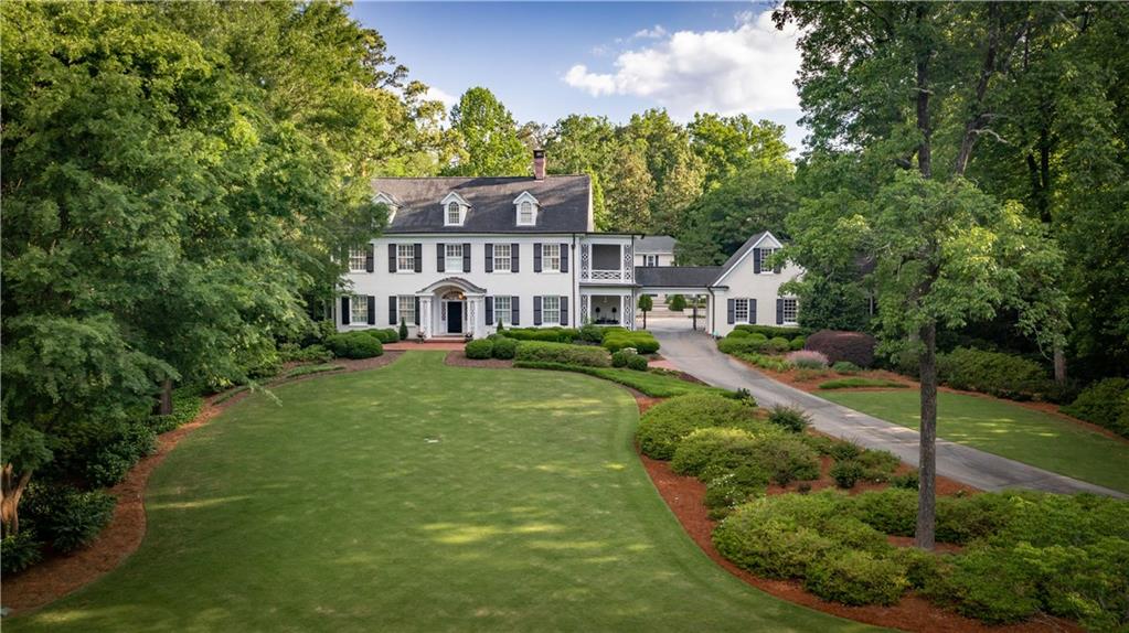 Perfectly situated on 1.9 acres in Buckhead’s elegant Haynes Manor, this home sits atop the end of a long drive leading to the classically beautiful, sprawling estate. Built in 1925, the historically recognized Boynton House was magnificently renovated, expanded and then updated throughout once again in 2021. 6 bed, 6.5 baths in the main residence w/ 2 additional bedrooms & baths in pool guest house and 1 BR/1 bath in garage apartment. From the grounds to the interior space, this home is a perfect masterpiece. The location instantly connects to the Buckhead lifestyle.