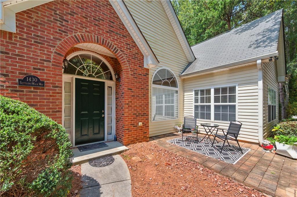 Welcome to this spacious 3 bedroom, 2 bathroom, one-level patio home, ideally situated in a quiet part of the neighborhood! Perfect for easy living, the open floor plan features a cozy gas fireplace in the inviting family room, ideal for relaxing evenings. The bright sunroom, with its soaring high ceilings, offers a versatile space perfect for a home office, morning coffee, or a reading nook. The 3 bedrooms are generously sized. Step outside to enjoy your private outdoor patio area. The spacious two car garage offers extra space for storage. Neighborhood amenities include a pool, clubhouse, and small exercise area, perfect for staying active and social. Just minutes from the Silver Comet Trail, Hurt Road Park, and a variety of nearby shopping and dining options, this home combines the ease of one-level living with desirable community features and a great location!