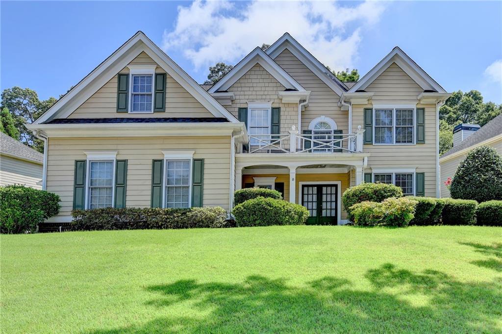 Beautiful home in the Hamilton Mill Community. The neighborhood features a golf course, swimming pool, tennis courts, pickleball, ball field, playground, and more. This home features an oversized master suite with tray ceilings, walk-in closet, double vanity, separate shower and tub. Three additional bedrooms are spacious. The kitchen has an open view to the family room which features a two-story ceiling, built-in bookcases, and a fireplace. There is a breakfast area and a separate dining room. Another room can be used as an office, sitting area, library, or multiple other uses. Outside, the lawn is well landscaped. The backyard features two different areas: a backyard right off the patio, and steps leading up to a flat area that could be used for gardening, entertaining, or recreation. The home has a three-car garage. Home being sold As-Is. Located near shopping, restaurants, and schools, and conveniently located near I-85 and just a few minutes from the Mall of Georgia area.