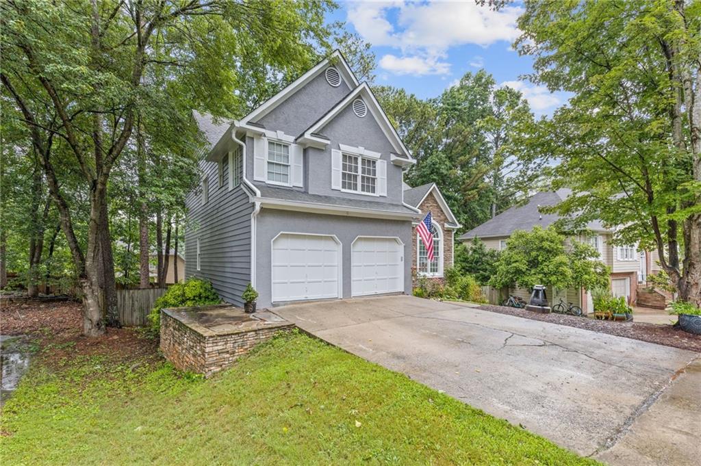 This one just feels like home. From the moment you walk in, you're greeted by warm natural light, soaring ceilings, and a an open functional layout. The two-story family room and eat-in kitchen flow together for everyday life or easy entertaining—and yes, the kitchen’s got all the good stuff: white cabinets, gas stove, stainless appliances, and great counter space.
Step outside and you’ve got a deck right off the kitchen that’s begging for dinner parties or morning coffee. The backyard is fully fenced and wide open with potential—add a garden, a fire pit, or just let the dog run wild. There’s even a separate laundry/mudroom so coats, backpacks, shoes, and laundry day chaos all stay out of sight.
Upstairs, the primary suite is your own little escape—tray ceilings, large double walk-in closets, and a ensuite bathroom with soaking tub, dual vanities, and separate shower. On the opposite side of the primary suite, two additional bedrooms share a Jack-and-Jill bathroom—perfect for kids, guests, or both.
Need more space? Head downstairs to the finished basement. Whether you want a media room, office, home gym, playroom—or all of the above—there’s plenty of room to spread out.
Located in a quiet, sidewalk-lined neighborhood with a pool and tennis courts just a short stroll away, you’re close to everything: Downtown Woodstock, Lake Allatoona, parks and trails, grocery runs, Home Depot, KSU, and The Outlet Shoppes. Plus, top-rated schools and quick access to I-575 make everyday life a little easier.
Fresh paint inside and out, updated lighting, hardwood and LVP throughout—this place is move-in ready and packed with personality. Come see why it’s an easy “yes.”
