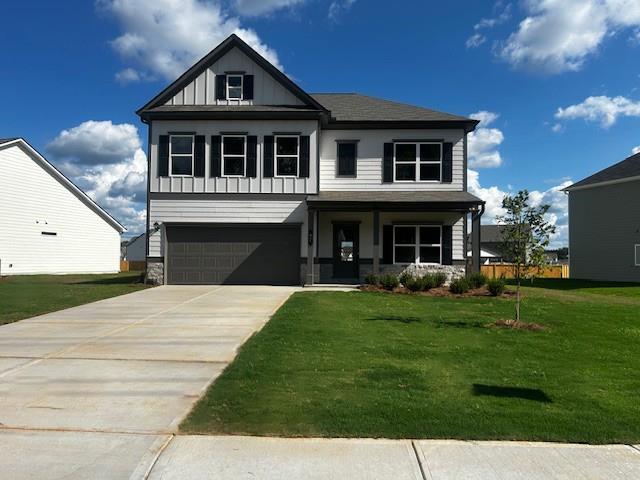 Move in Ready! The James plan in the Jackson Farm community, built by Smith Douglas Homes. Jackson Farm is a swim community! Flexibility is the hallmark of The James plan. The home features a large separate dining room, fireside family room, bedroom and full bath, well appointed kitchen with granite, upgraded cabinets, tile backsplash, a generous pantry area, and a large island. There is a butler's pantry between the dining room and kitchen for easy entertaining. The large mudroom off the garage gives you the space you need to drop your belongings by the door on your way in or out! Amenities on the second floor include a spacious and convenient laundry room with a sink, an open loft and an Owner's suite with a sitting room, owner bath has separate tiled tub and shower, two guest bedrooms and two full baths. All this on a level homesite with a covered patio. Both stories have nine ft ceiling heights! Photos are representative of plan not of actual home being built. Seller incentives with use of preferred lender.