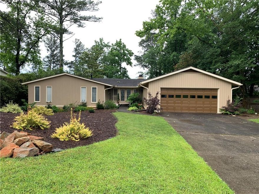 Peaceful Ranch Home on an Unfinished Basement in sought after Indian Hills.  This one level home has three Bedrooms, two Baths on the main level with Screened Porch and Deck overlooking a private backyard.  Home has some updates and ready for you to add your touched to make it your perfect place to call home. *** Lovely leaded front doors invite you to a warm and inviting home.  Newer wood floors and generous rooms highlights the home.  Enjoy the stacked stone fireplace in the Great Room with vaulted ceilings.  Here you have a rare wood burning fireplace.  The oversized Kitchen has newer stainless-steel appliances and generous Eating Area with space for a sizeable table. Off the Kitchen is a Laundry Room.   Thel Dining Room could be used as an Office or Den. *** The Primary Bedroom is spacious with two large closets.  Primary Bath has some updated with two vanities and walk-in shower.  Two Additional Bedrooms with compartmented Hall Bath complete the main level of home. *** The Lower Terrace is unfinished with Full Bath stubbed.  Create a media room and bedroom or wine tasting room and tv area.  There is also a generous storage area. *** Off the Great Room the Screen Porch look over the private backyard.  In addition, there is a Deck and Side Deck. *** Home is conveniently located in East Cobb to shopping, entertainment, and recreation. Great opportunity to be in Indian Hills for under $1m.