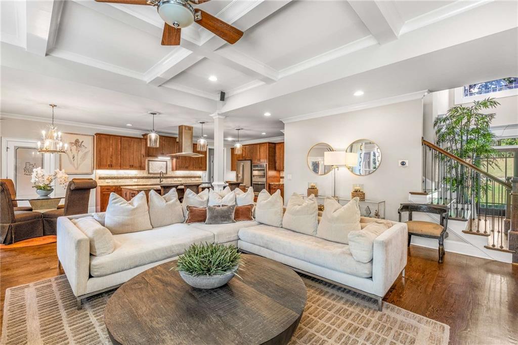JUST LISTED this gorgeous home with a 4 CAR GARAGE ! Edinburgh's custom home in Bear's Best award-winning golf course community designed by Jack Nicklaus and offers three levels of extraordinary living and elegance. This exquisite home offers 6 spacious bedrooms with a flat backyard overlooking the golf course . There's a spacious covered deck upstairs perfect for outdoor dining and relaxation. Upon entering a foyer with high ceilings this home offers abundant natural light . The open-concept living area is perfect for both entertaining and everyday living, featuring a chef's gourmet kitchen with high-end appliances , mudroom, walk-in pantry and a stylish breakfast nook leading to the covered deck. The family room boasts a cozy stacked stone fireplace .The dining room is perfect for entertaining. The study is located on the main floor along with a guest bedroom on the main level with a private bathroom. Upstairs , the primary suite is a true retreat with a fireplace, a lavish en-suite bathroom with double vanities. The loft / media room upstairs is a perfect game room.The finished basement with very high ceilings with family room space with a fireplace and a wet bar, a large bedroom, walk-in closet and full bathroom. Also, additional unfinished storage space. Edinburgh is a golf cart friendly neighborhood and offers fantastic amenities, including an Olympic-size pool, a waterslide, tennis courts, a fitness center, a playground and a basketball court. The very active homeowners' association plans multiple social events throughout the year. The neighborhood is moments from the Chattahoochee River, a short ride to Suwanee Town Center, Lake Lanier, destination shopping, dining and entertainment. All this in North Gwinnett's award winning schools. Riverside Elementary, North Gwinnett Middle School and North Gwinnett High School. There's an assumable VA loan with low rate if needed.HURRY THIS HOME WON'T LAST LONG!