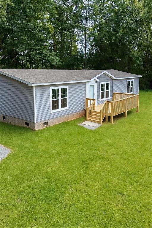 Brand new 3-bedroom, 2.5-bath mobile home nestled on a beautiful 1.79-acre tract with creek in the heart of Northeast Georgia. This mobile home offers modern design and country charm, with an open floor plan, abundant natural light, and large windows that bring the outdoors in.
Step inside to discover a spacious, light-filled layout ideal for entertaining or simply relaxing. The open-concept kitchen and living area make this home feel airy and inviting. With three generously sized bedrooms, including a primary suite with a private bath, there's plenty of room for family and guests.
Outside, enjoy your morning coffee on the front porch or unwind in the evening on the back porch, both offering peaceful views of the surrounding woods and the gentle sounds of nature. The lot extends all the way back to a small creek, adding to the tranquility and appeal of the property.
Located in a quaint, scenic area, this home offers privacy, room to roam, and the comfort of new construction — all just minutes from town conveniences.