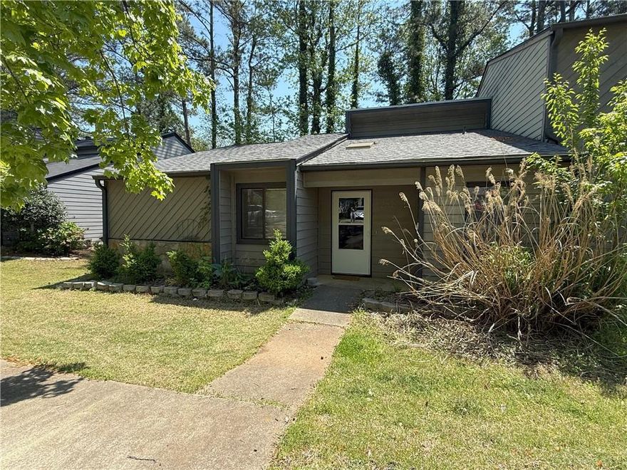 Great location! Beautiful one-level end unit minutes to Shopping, Restaurants, Marietta Square and more! Roommate floor-plan, freshly interior painted, updated flooring, well-maintained with modern updates and elegant lighting throughout. Spacious Vaulted family room with stone fireplace opens to the dining area, new deck great for entertaining family and shed for storage. Renovated kitchen with stainless steel appliances and lots of nature lighting. Large laundry room with W&D included. Spacious bedrooms with their own private bath. Move-in ready after 5/7/2025.