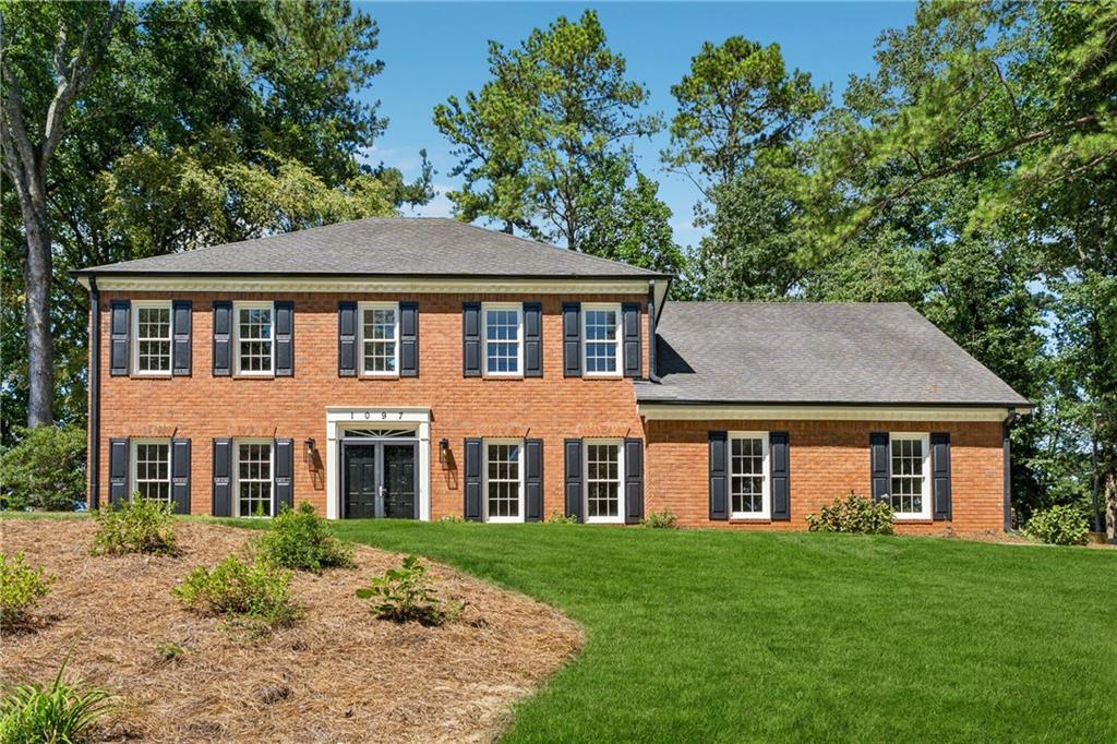 Welcome to this beautifully renovated brick-front home in Princeton Walk, one of East Cobb’s most desirable and well-maintained communities. With only 130 homes, Princeton Walk offers a close-knit feel with swim and tennis amenities, all within the top-rated Mount Bethel, Dickerson, and Walton school district. Homes in this neighborhood very rarely come available.
The main level features formal living and dining rooms, a spacious family room, and a light-filled sunroom with views of the backyard. The updated kitchen with vaulted eat-in area connects seamlessly to both the family and sunroom spaces. A laundry room with sink and convenient half bath complete the main level.
Upstairs, the primary suite includes a private sitting room, bathroom with double vanities and walk-in shower, plus a generous walk-in closet. Three additional bedrooms share a guest bath with double sinks, while two staircases provide easy flow.
Outside, enjoy a large, level backyard—perfect for entertaining, play, or future customization. With modern updates, classic features, and a fantastic location, this Princeton Walk home delivers the best of East Cobb living.