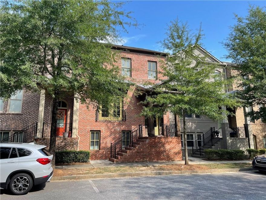 Conveniently located near Avalon, Halcyon, Costco, Lifetime Fitness and many other shopping/restaurants! GA 400 is easily accessible. Refreshed 3-story townhome with hardwood floors on main, new carpet, and fresh paint. Main floor features an open floorplan with the kitchen looking into the family room. Refrigerator, washer, dryer all included in the home! Community swimming pool and playground available. Water and landscaping covered by the community! **NO PETS or SMOKING** MOVE-IN READY! This won't last!