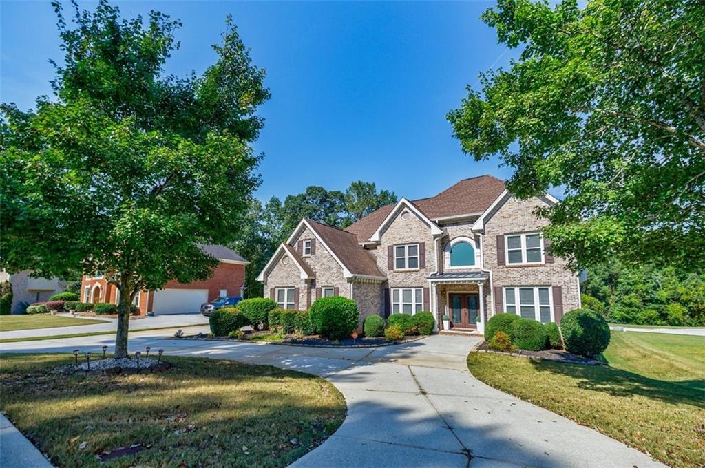 Words can’t do justice to nearly 4,800 square feet of living space with seven true bedrooms, five full baths, and a jaw-dropping stacked-stone fireplace soaring in a cathedral-ceiling great room. So here are the essentials, while the photos, video, and 3D tour speak for themselves: a new roof was added in 2017; all 52 windows replaced with solar-zoned glass, half screens, and lifetime warranty; the primary walk-in closet reimagined with a California Closet system in 2017; a new irrigation panel in 2022; and a whole-house smart system powered by an Alexa Hub. Fall in love with the dream kitchen and expanded main-level deck with terrace-level patio below. Entertain year-round in the finished basement complete with wet bar, second refrigerator, pool table area, media zone with built-ins for even the largest TV, and a separate entry perfect for multi-generational living, teen suite, or au pair/nanny apartment. Don’t miss the Murphy bookcase concealing hidden storage and exterior access. And for a dash of early millennium charm, you’ll find a working Classic built-in intercom and built-in speakers; layered lighting in nearly every room, and even a whimsical train-on-track circling above the pool table lounge. Now, without further delay, start swiping through the incredible photos and video tour—because this home is truly best experienced in pictures.