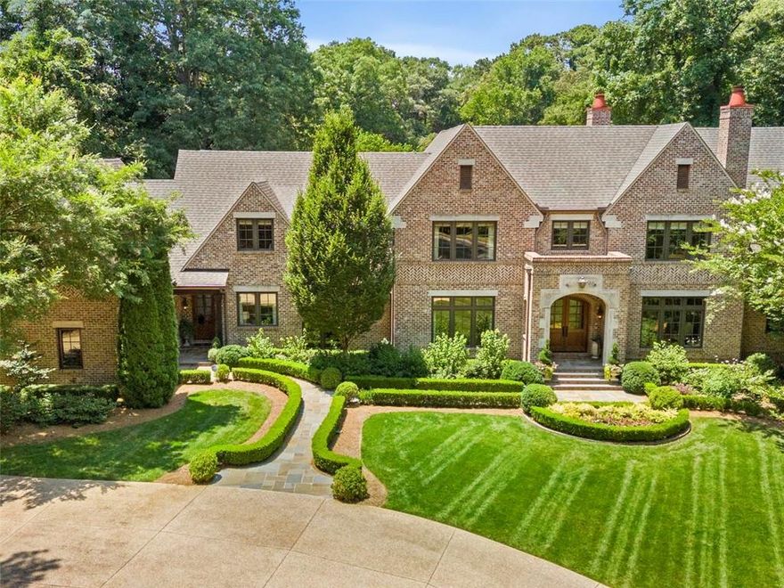Nestled at the end of a tranquil lane in the prestigious enclave, the Paces Civic Association, on the West side of Buckhead, this meticulously crafted custom estate spans over 2.1 acres of lush, level grounds. Designed by the renowned architects Harrison Design and completed in 2014, and then the terrace level finished in 2018, this masterpiece showcases unparalleled attention to detail and superior craftsmanship. Constructed by builder Tony Reaves of Intown Builders Group, this residence offers a private haven in a serene setting just moments away from esteemed educational institutions such as Pace Academy, Lovett, and Westminster schools.
Situated in an enclave where minimum lot sizes are 2 acres, this distinguished property boasts an exceptional floor plan that seamlessly integrates indoor and outdoor living, with expansive spaces that open to the inviting pool and verdant surroundings. This home also features a whole house generator and space for an  elevator to all three levels.
The main level presents a sumptuous primary retreat with direct access to the pool and spa, creating a luxurious haven for relaxation. The open floor plan has the perfect chef's kitchen with custom Karpaty cabinets, Sub Zero and Wolf appliances, quartzite countertops and a separate and very large pantry. Walk out to the loggia with outdoor kitchen, fireplace  and pool bath. The kitchen opens to the family room with fireplace and french doors out to the pool.  Separate and large dining room with butlers pantry.  Upstairs, discover three gracious bedroom suites alongside a guest suite apartment, complemented by an additional living area and a private office or artisan's studio.
The newly constructed daylight terrace level offers a haven for entertainment enthusiasts, boasting a spacious area perfect for watching sports, complete with a well-appointed bar featuring a tap. Further enhancing the lifestyle offerings are a gym, guest suite, and two full bathrooms, providing ample space for both leisure and accommodation.
Rarely does a residence of this caliber become available in such an esteemed locale, making this exceptional property a rare gem in the coveted Buckhead neighborhood that borders the Chattahoochee River. Minutes from the best private schools in Atlanta and shopping. Beautiful walkable streets with hardly any traffic. Private security patrol for the neighborhood.  Excellent opportunity.