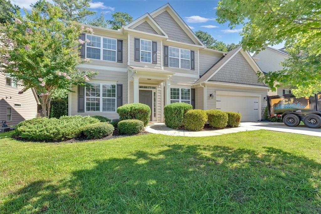 Welcome to Lakestone! This beautifully remodeled home is filled with natural light and thoughtful details throughout. Step into the bright two-story living room, where oversized windows and a cozy fireplace make it the perfect gathering spot. The main level offers both formal living and dining spaces, plus a freshly updated half bath. Just outside, a covered patio overlooks your private fenced backyard...the kind of space that makes morning coffee and evening unwinds feel like a retreat. Upstairs, you’ll find a spacious owner’s suite with room to relax, along with three additional bedrooms and a full bath. Every inch of this home has been lovingly updated—just move right in. Set in the heart of Lakestone, you’ll enjoy access to all the neighborhood favorites: a sparkling pool, tennis and pickleball courts, a playground, and even a scenic lake with catch-and-release fishing. With sidewalks throughout, top-rated schools, and an unbeatable location just minutes from Downtown Woodstock and Downtown Roswell, this one truly checks all the boxes.