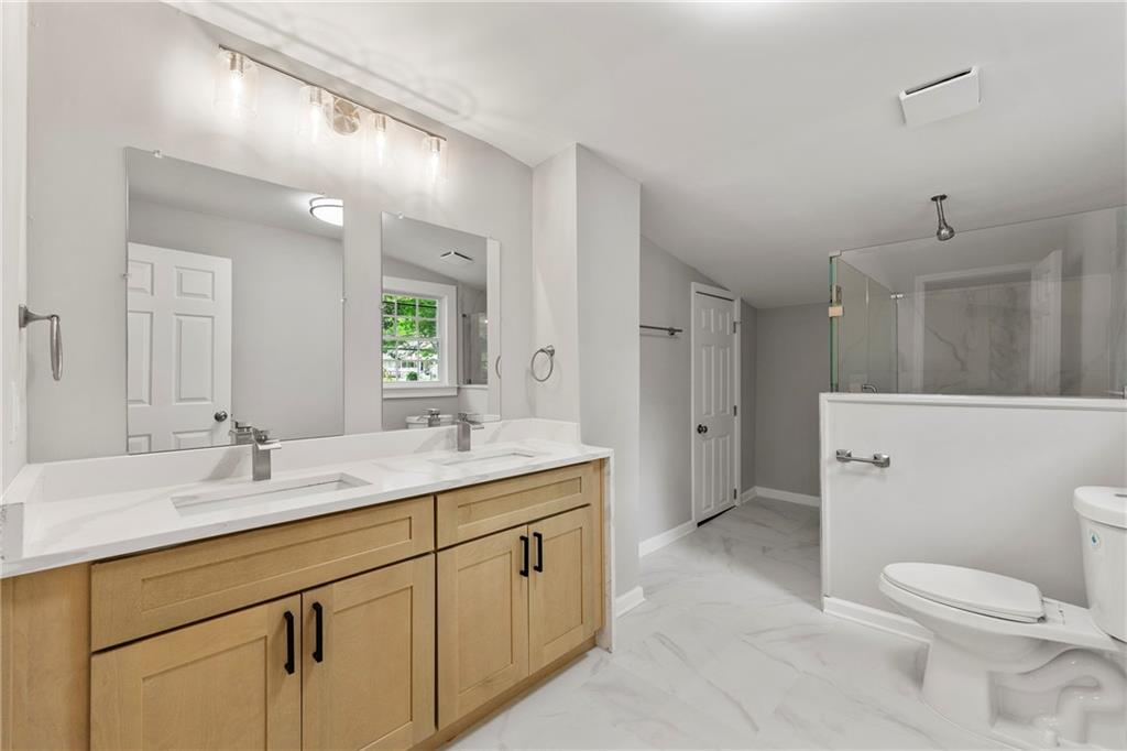 Welcome to this fully renovated two-story home. The open-concept layout boasts a living room with a modern accent wall, and a stylish kitchen with stainless steel appliances and quartz countertops. Enjoy brand new flooring and fresh paint throughout. The master bedroom upstairs includes an ample bath with a beautiful walk-in shower and a double vanity. There are two additional bedrooms upstairs with a shared full bathroom, and one bedroom and a full bathroom on the main floor. Enjoy the convenience of a fenced yard and plenty of parking space. Located in a desirable area with easy access to shopping and dining while having lots of privacy with a wooded backyard. Don't miss out on this beautiful rental opportunity, and reach out to us today!