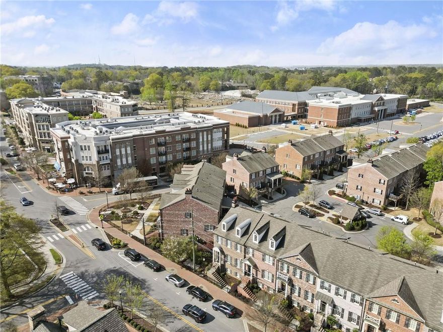 Welcome to The Georgian Townhomes in the Garden District - the heart of downtown Alpharetta yet off the major thoroughfare! Enjoy all the best access to shopping, dining, parks, green spaces, and nightlife. Plus, it's an easy distance to it all in #AwesomeAlpharetta. Freshly painted throughout, this home has received plenty of TLC and is in move-in condition, ready for a quick closing. Experience the beauty of Spring in your new home! Main Level - Open concept living with a powder room and a rear deck offering stunning sunset views. Upper Level - This level features a spacious bedroom suite facing the rear of the property, easy laundry space, two secondary bedrooms, and a full bathroom. Lower Level - The lower level includes an entry from the rear garage and offers a flexible space that could easily become a fourth bedroom with an adjacent full bath, closets, and extra storage. It can also serve as a private guest suite, ample home office space, media or exercise room - just bring your vision. And be sure to notice the great storage areas in the "flex space" on the ground level and the spacious closets through-out! This home offers a perfect blend of modern living and convenience in one of the most sought-after locations. Don't miss the opportunity to make it yours.