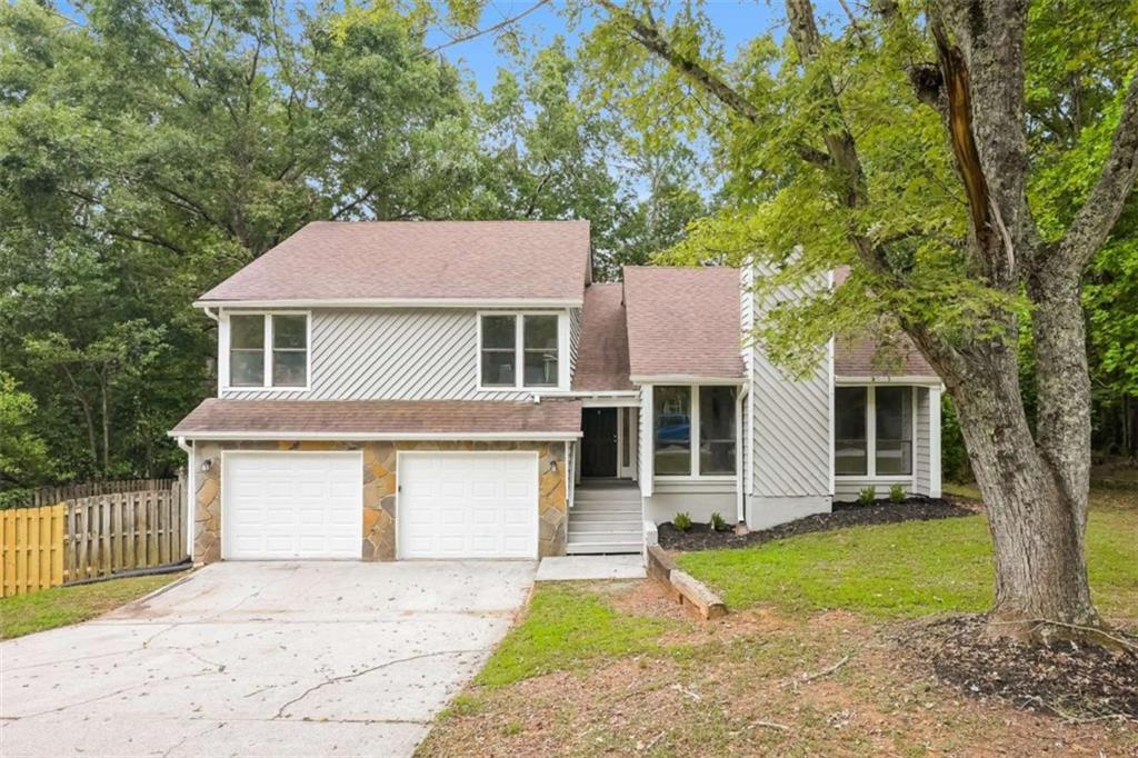 Welcome to this beautifully refreshed Stone Mountain home! Featuring brand-new flooring throughout and a complete interior and exterior paint job, this residence is move-in ready and shines with curb appeal. The open and inviting floor plan offers comfortable living spaces with natural light pouring into every room. A spacious kitchen, cozy dining area, and generously sized bedrooms provide plenty of room for relaxation and everyday living. Outside, the private backyard is perfect for entertaining, gardening, or simply enjoying peaceful evenings. Conveniently located near schools, shopping, parks, and major highways, this home blends modern updates with an excellent location. With all the recent renovations, it's ready for its next owner to make it their own. Don't miss your chance to tour this property-schedule your showing today!