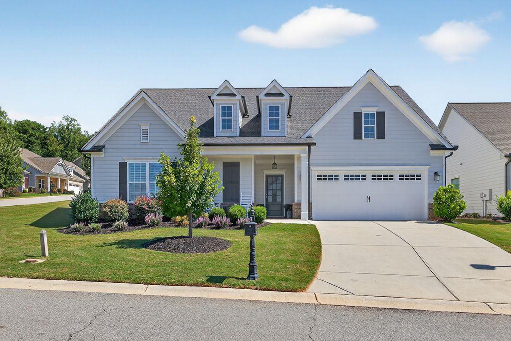 Welcome to this stunning former model home in the highly sought-after Traditions of Braselton community! Built just 2 years ago and in like-new condition, this 4-bedroom, 3-bathroom home sits proudly on a corner lot with a beautifully landscaped, fenced yard.
Inside, you’ll find a spacious open-concept layout with a large primary suite on the main level, complete with a luxurious en-suite. The chef’s kitchen is a dream with a huge island, white cabinetry, and granite countertops, perfect for both entertaining and everyday living.
Upstairs offers a versatile bonus room—ideal for a playroom, media room, or home office. Step outside to your private retreat featuring a relaxing hot tub and plenty of space to enjoy the outdoors.
Living in Traditions of Braselton means you’ll have access to an array of exclusive amenities, including a private golf club, resort-style pool, tennis and pickle ball courts, a fitness center, walking trails, and a community restaurant—all just steps from your door.
This home truly has it all—luxury, comfort, and a vibrant lifestyle!
