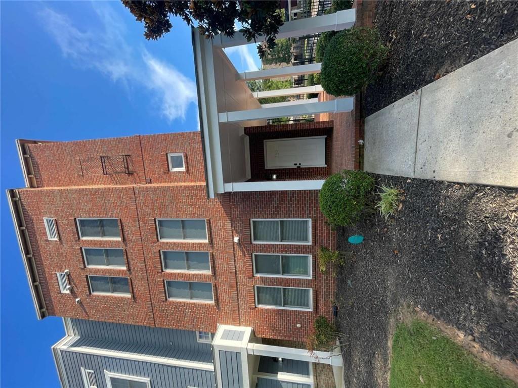 Stunning 3-story end-unit in prime downtown Atlanta location! This beautifully designed town home offers the perfect blend of style, comfort, and convenience. Featuring elegant 2-sided brick construction with stately columns and a partial wrap-around front porch, this home makes a lasting first impression. Inside, enjoy a spacious and open layout on the main floor that is spanned with wood floors and a kitchen with stainless steel appliances, a breakfast bar with unique pendant lighting, double-door pantry, and granite counter tops that seamlessly overlooks the expansive family room. Boasting a roommate-friendly floor plan, each bedroom features its own private full bathroom with every shower upgraded with modern stone finishes. The over-sized primary suite includes dual walk-in closets and a luxurious en-suite bath with double vanities, a stand-up shower, and a soaking tub. Additional highlights include a WASHER AND DRYER and 2-car garage for ample parking and storage all while located in a gated community with two easily accessible entrances. Step outside to a generous back deck making it the ideal place for unwinding or entertaining guests. Located in the heart of downtown Atlanta, you'll enjoy easy access to shopping, dining, entertainment, and major highways making this the perfect place to call home! APPLY NOW BEFORE IT'S GONE! Qualifications are as follows: Applicants must gross 3x the monthly rent ($8,700+). No previous evictions will be accepted. No bankruptcies, car repossessions or collections in the last 24 months will be accepted. Minimum one-year lease. Pets allowed with a $400 non-refundable pet deposit. $75.00 application fee for all occupants over 18 years of age. Professionally managed. No minimum credit score requirement!